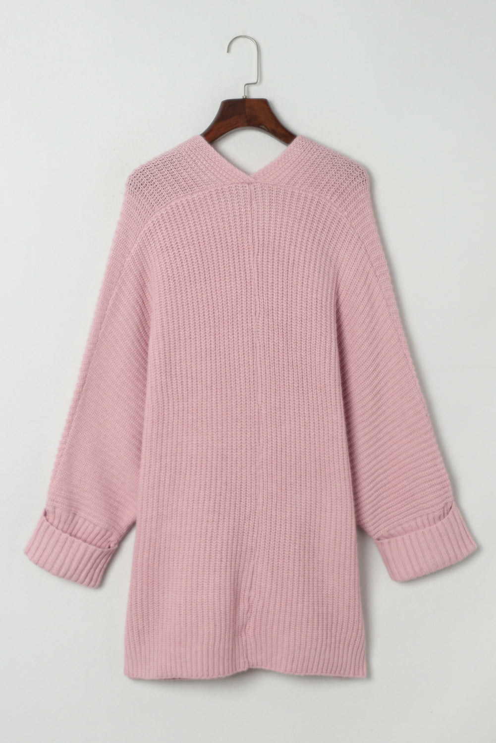 Rosafarbener Oversize-Strickpullover mit umgeschlagenen Ärmeln