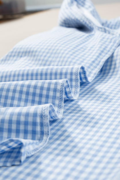 Hellblaue Bluse mit Puffärmeln und Blumenstickerei im Gingham-Stil