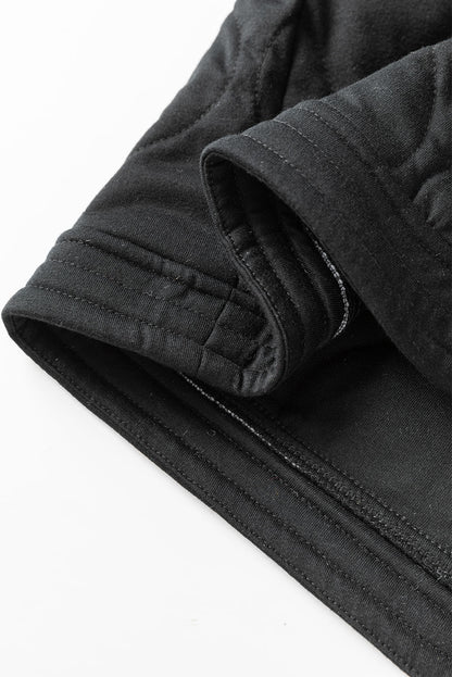 Schwarze, einfarbige, gesteppte Jacke mit Druckknöpfen