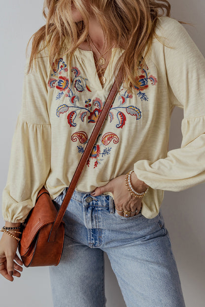 Aprikosenfarbene Bluse mit V-Ausschnitt und Paisley-Blumenstickerei