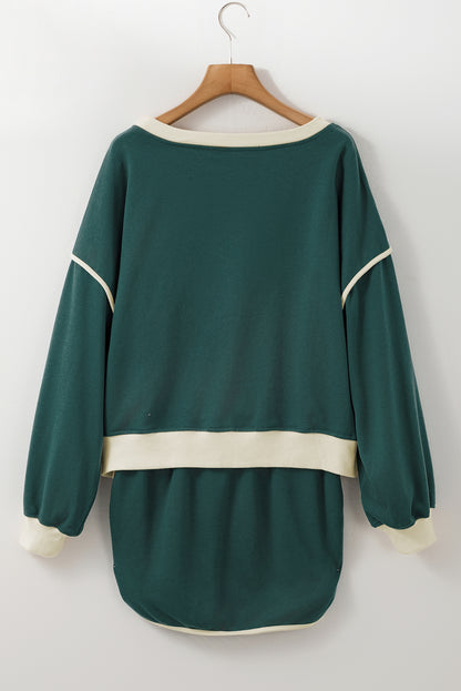 Evergreen Set mit lockerem Pullover in Kontrastfarbe und Skort mit Schnürung in der Taille