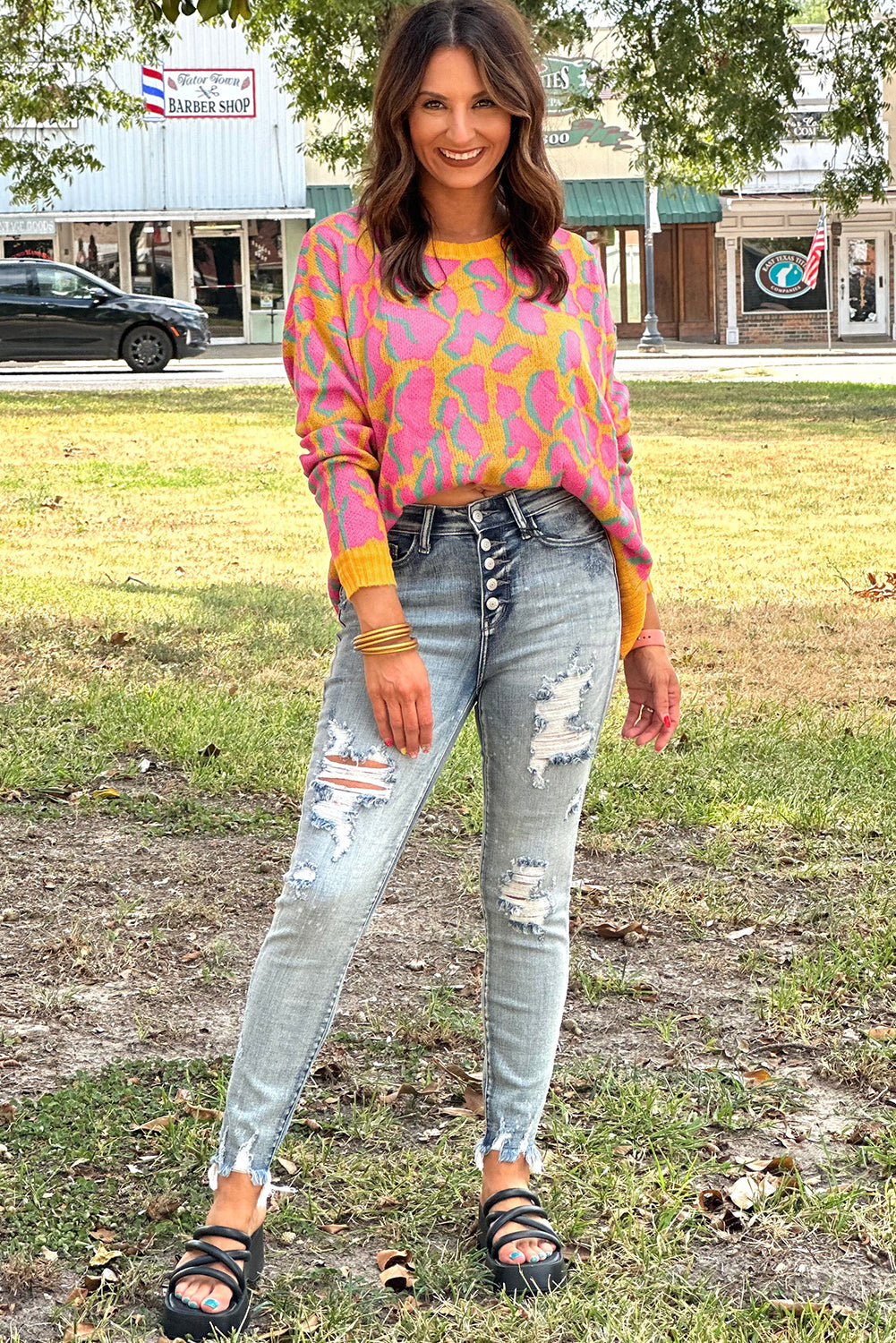 Vitality – Orangefarbener Baggy-Pullover mit abstraktem Print und geripptem Saum