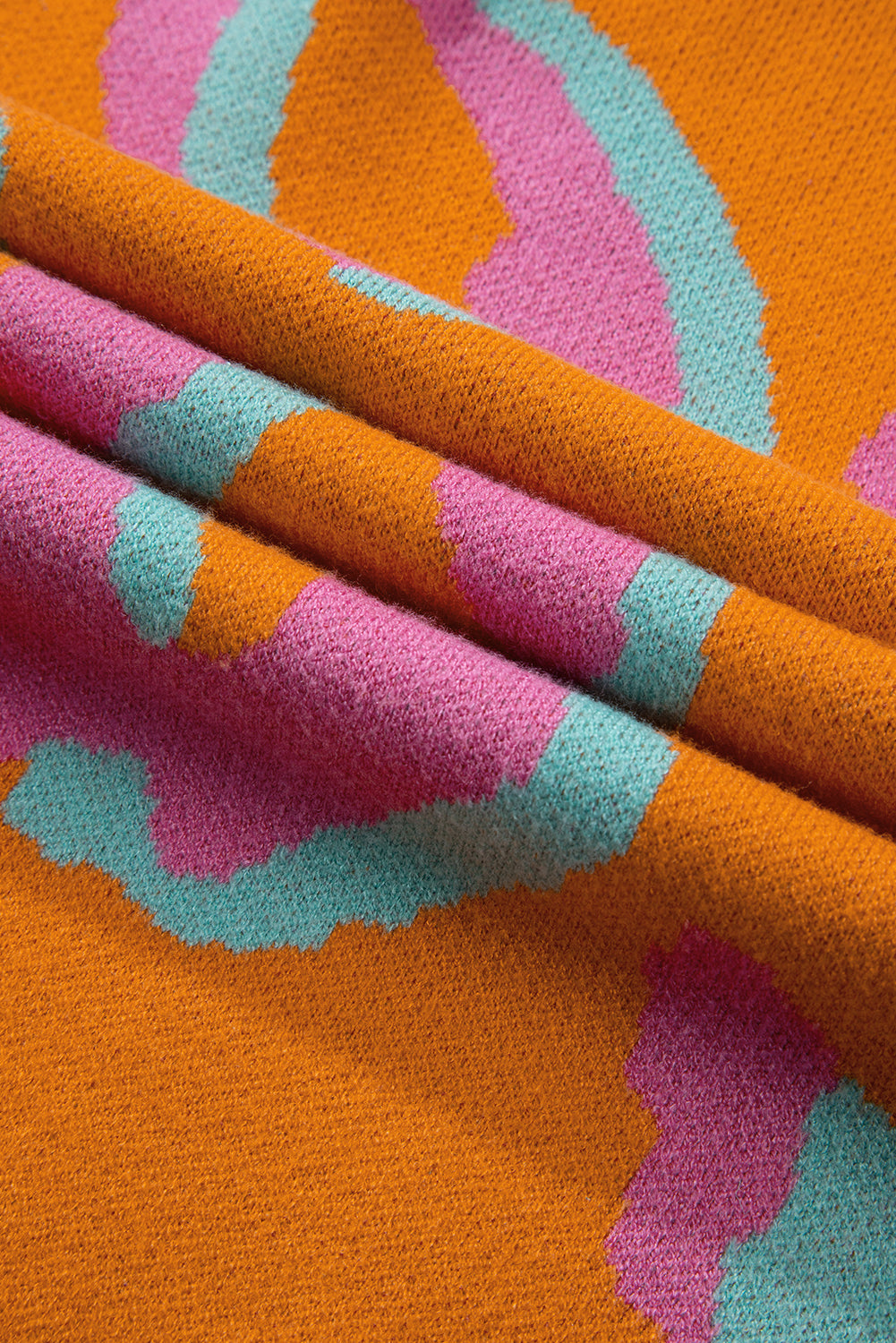 Orangefarbener Pullover mit Leopardenmuster und geripptem Rand im Colorblock-Design