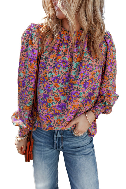 Lila Bluse mit Rundhalsausschnitt, Blumenmuster und gerafften Bündchen