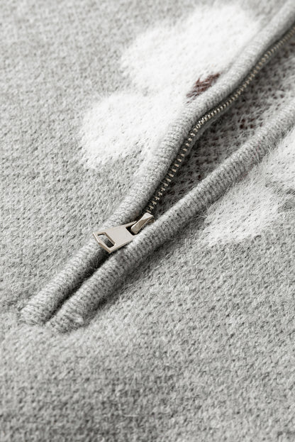 Grauer Pullover mit Blumenmuster und halblangem Reißverschluss sowie überschnittenen Schultern