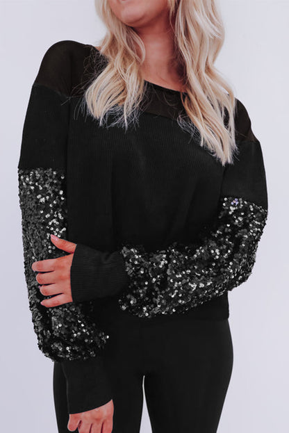 Schwarze Bluse mit Pailletten-Patchwork und Laternenärmeln