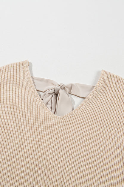 Aprikosenfarbener Pullover mit Laternenärmeln und V-Ausschnitt und Knoten hinten
