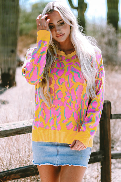 Vitality – Orangefarbener Baggy-Pullover mit abstraktem Print und geripptem Saum