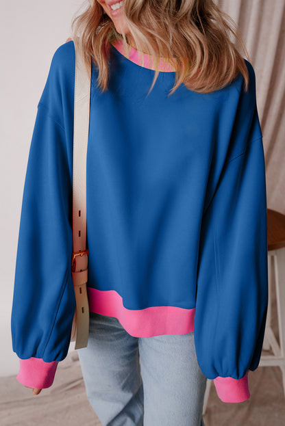 Blaues Sweatshirt mit Farbblock-Muster und Puffärmeln