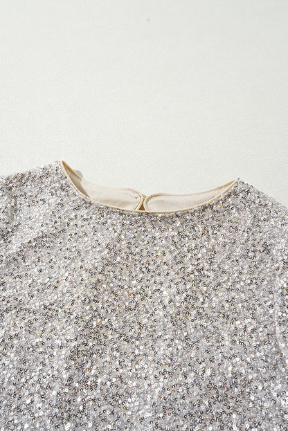Silberne Bluse mit Pailletten, Puffärmeln und Cut-Out am Rücken