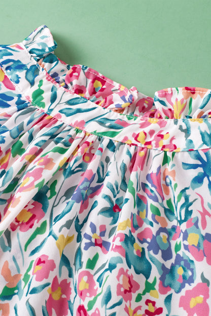 Rosa Bluse mit Blumenmuster, Knöpfen, Schlitz am Ausschnitt und Puffärmeln