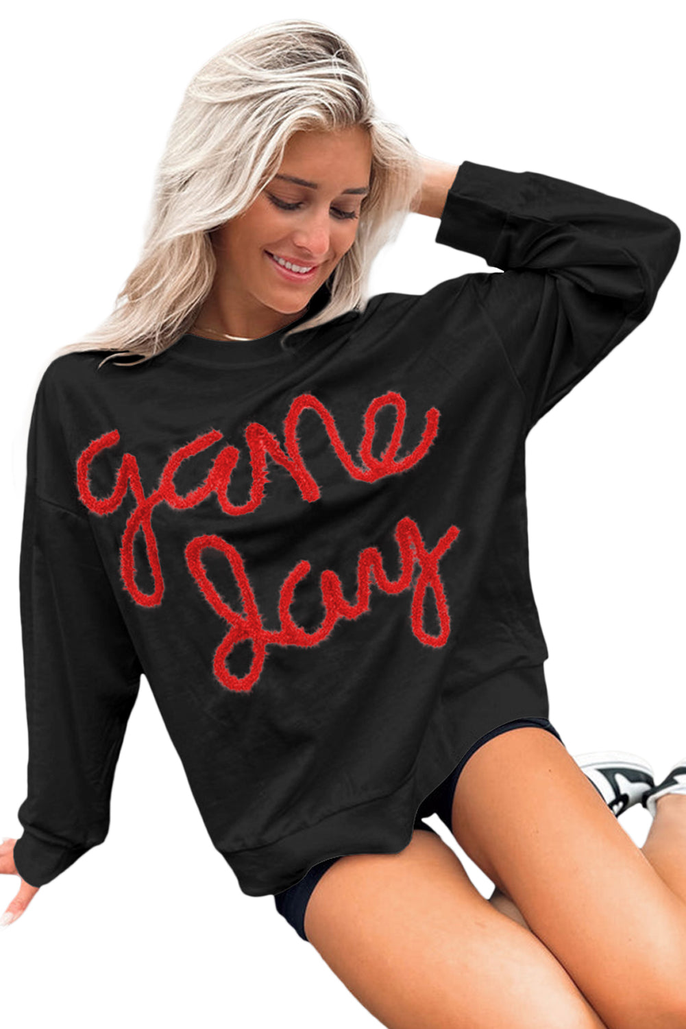 Schwarzes Lametta-Sweatshirt mit Game Day-Grafik und überschnittener Schulter