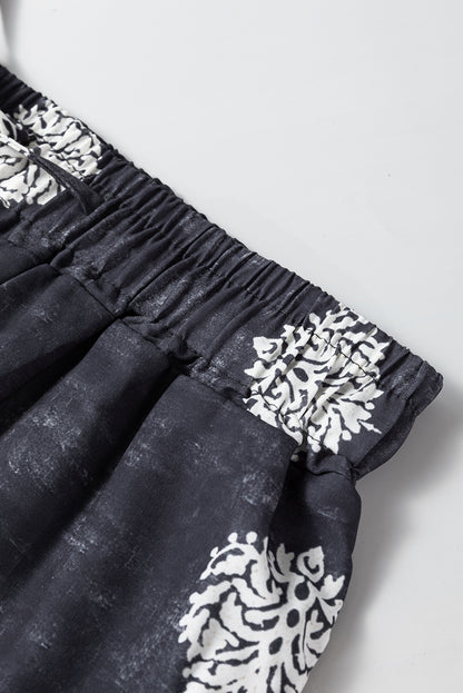 Schwarze Hose mit weitem Bein und Bohemien-Print