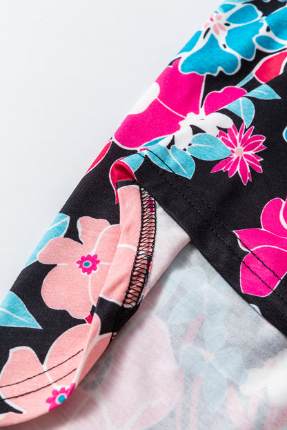 Rosa Bluse mit V-Ausschnitt und Rolllaschenärmeln und Blumenmuster