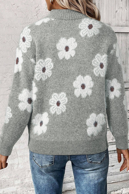 Grauer Pullover mit Blumenmuster und halblangem Reißverschluss sowie überschnittenen Schultern