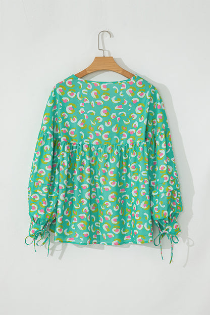Grüne Babydoll-Bluse mit abstraktem Print und Schnürung und Laternenärmeln