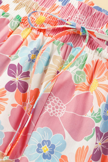 Rosafarbene, lockere Hose mit gesmoktem Bund und Blumenmuster