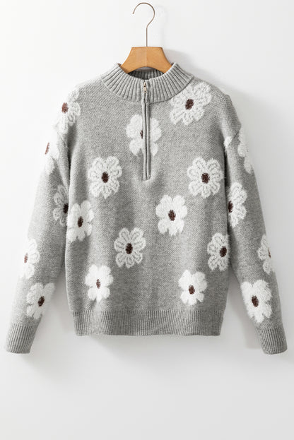 Grauer Pullover mit Blumenmuster und halblangem Reißverschluss sowie überschnittenen Schultern