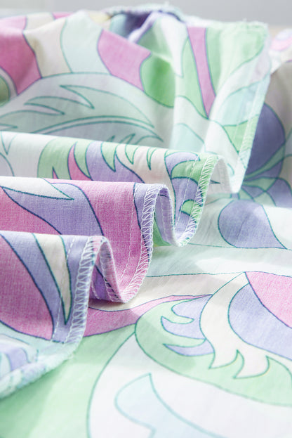 Grüne Bluse mit abstraktem Print und Puffärmeln