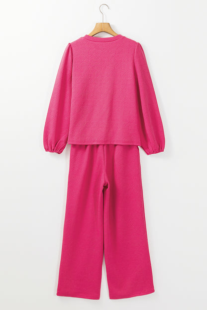 Rosarotes Set aus strukturiertem Oberteil und Hose mit Puffärmeln