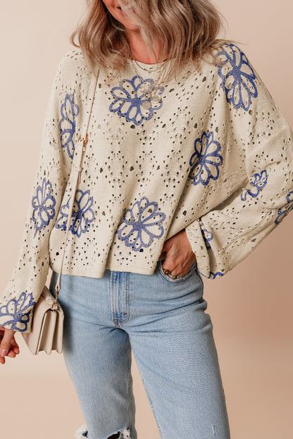 Beigefarbener Pullover mit kontrastierendem Blumenmuster und überschnittener Schulter