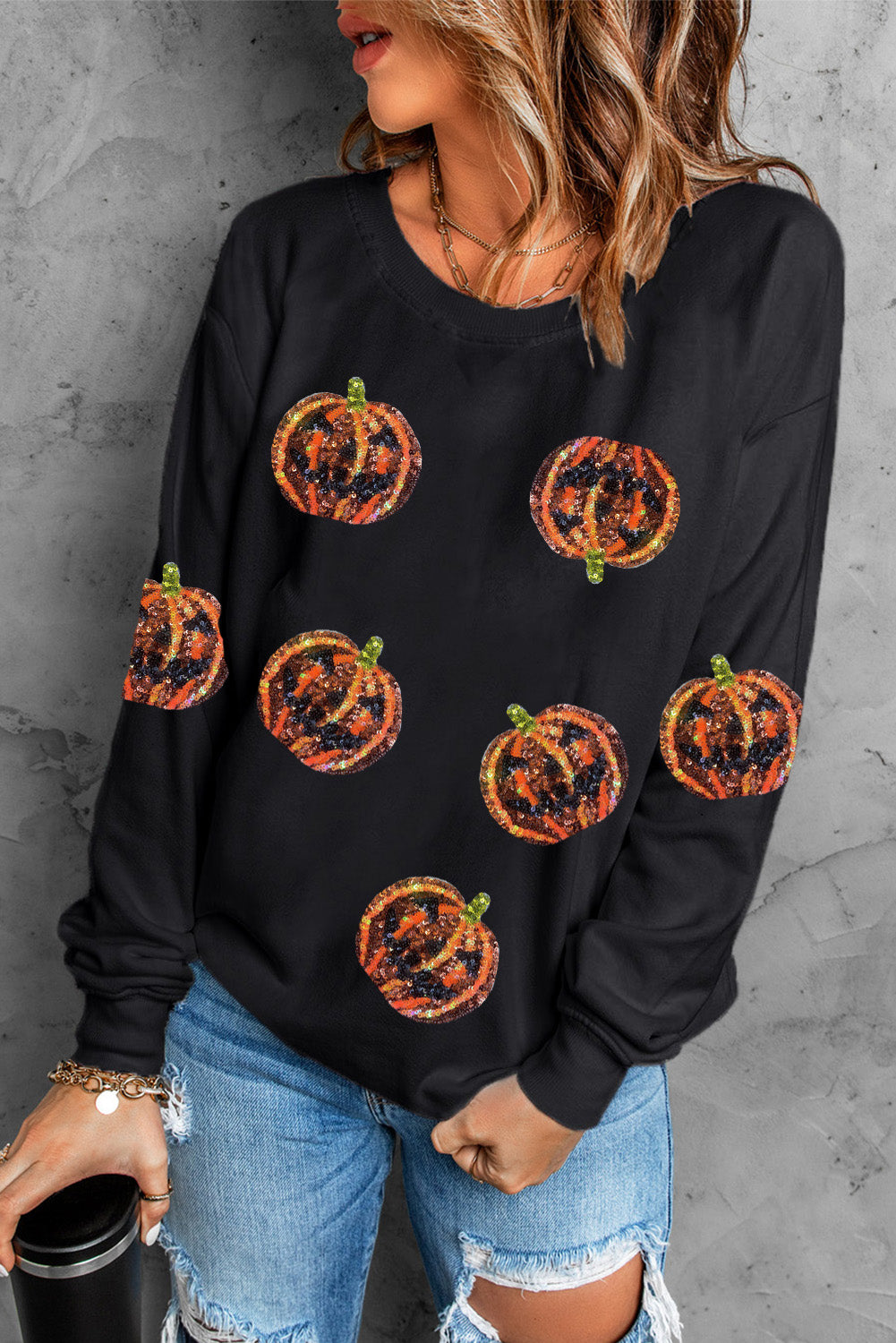 Schwarzes Pullover-Sweatshirt mit Halloween-Kürbis-Grafik und Pailletten