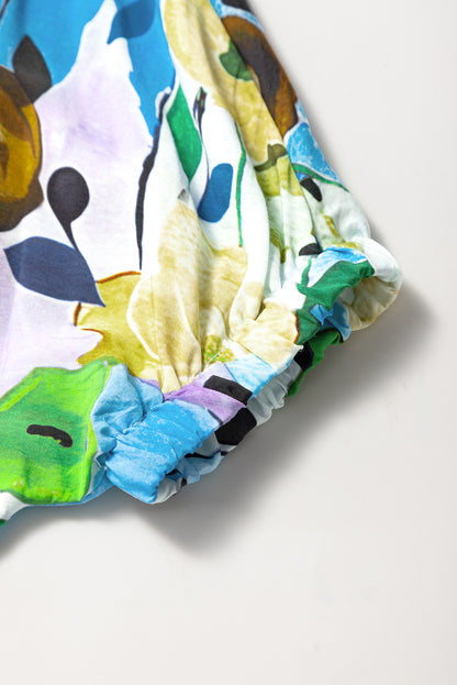 Hellblaue Bluse mit Blumenmuster und Schlitz und V-Ausschnitt, kurzärmlig