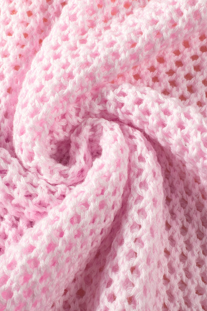 Hellrosa Strickpullover mit großer Blume und tief angesetzter Schulterpartie