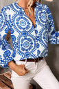 Himmelblaues Vintage-Hemd mit geometrischem Druck, Puffärmeln, Schlitz und V-Ausschnitt