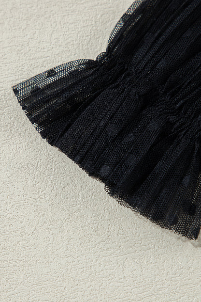 Schwarze Bluse mit transparenter Spitze und Stehkragen und langen Ärmeln