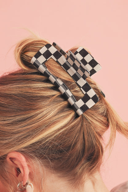Schwarze Haarspange mit Karomuster und Aussparungen