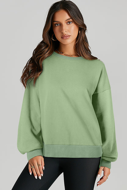 Grasgrünes, einfarbiges Sweatshirt mit Fleecefutter und überschnittener Schulterpartie und hohem Bund