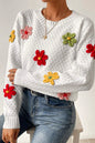 Weißer Strickpullover mit bunter Blumenapplikation