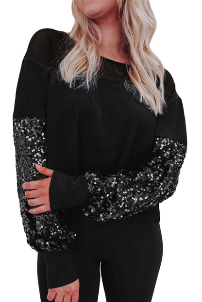 Schwarze Bluse mit Pailletten-Patchwork und Laternenärmeln
