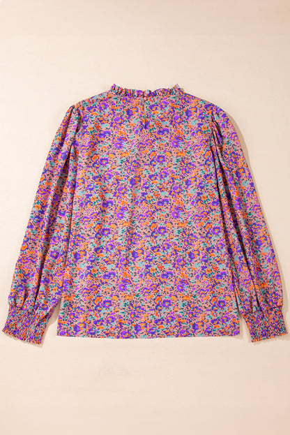 Lila Bluse mit Rundhalsausschnitt, Blumenmuster und gerafften Bündchen