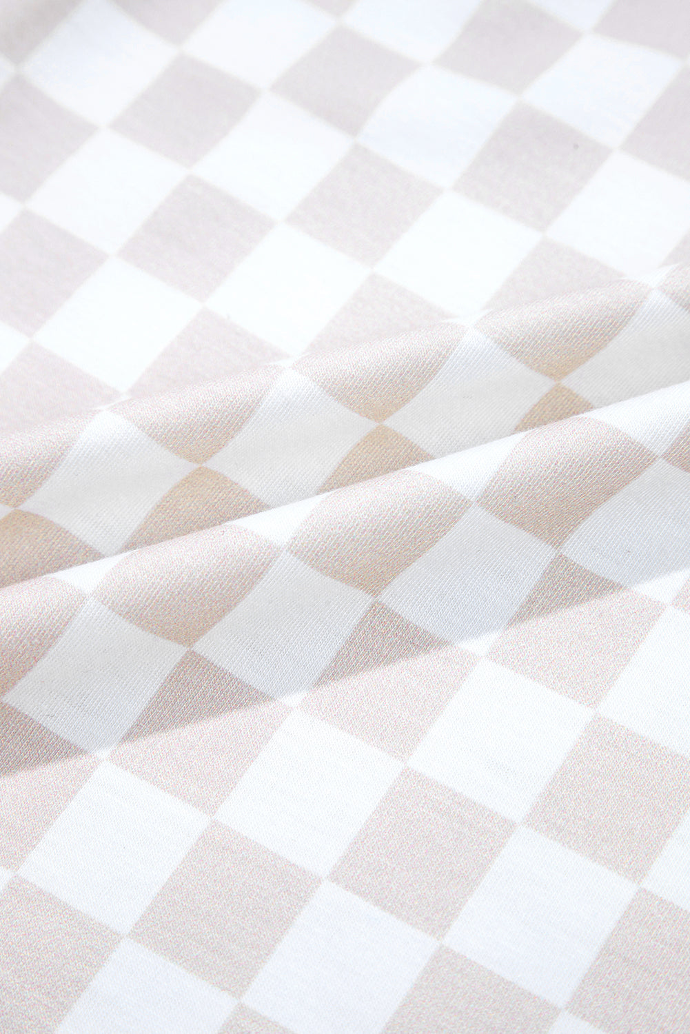 Aprikosenfarbener Jumpsuit mit weitem Bein und Karomuster, Rundhalsausschnitt und Knöpfen