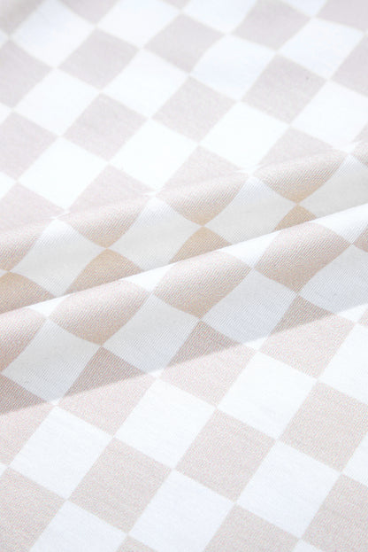 Aprikosenfarbener Jumpsuit mit weitem Bein und Karomuster, Rundhalsausschnitt und Knöpfen