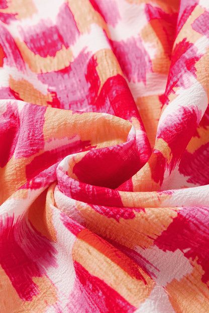 Rosafarbenes, ärmelloses Minikleid mit abstraktem Print und Rüschenkragen