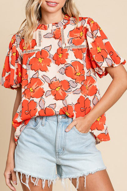 Orangefarbene Bluse mit Blumenmuster, Puffärmeln und Rüschenkragen