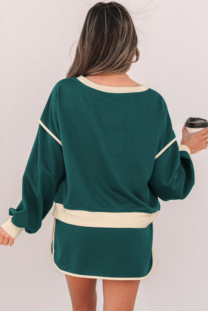 Evergreen Set mit lockerem Pullover in Kontrastfarbe und Skort mit Schnürung in der Taille