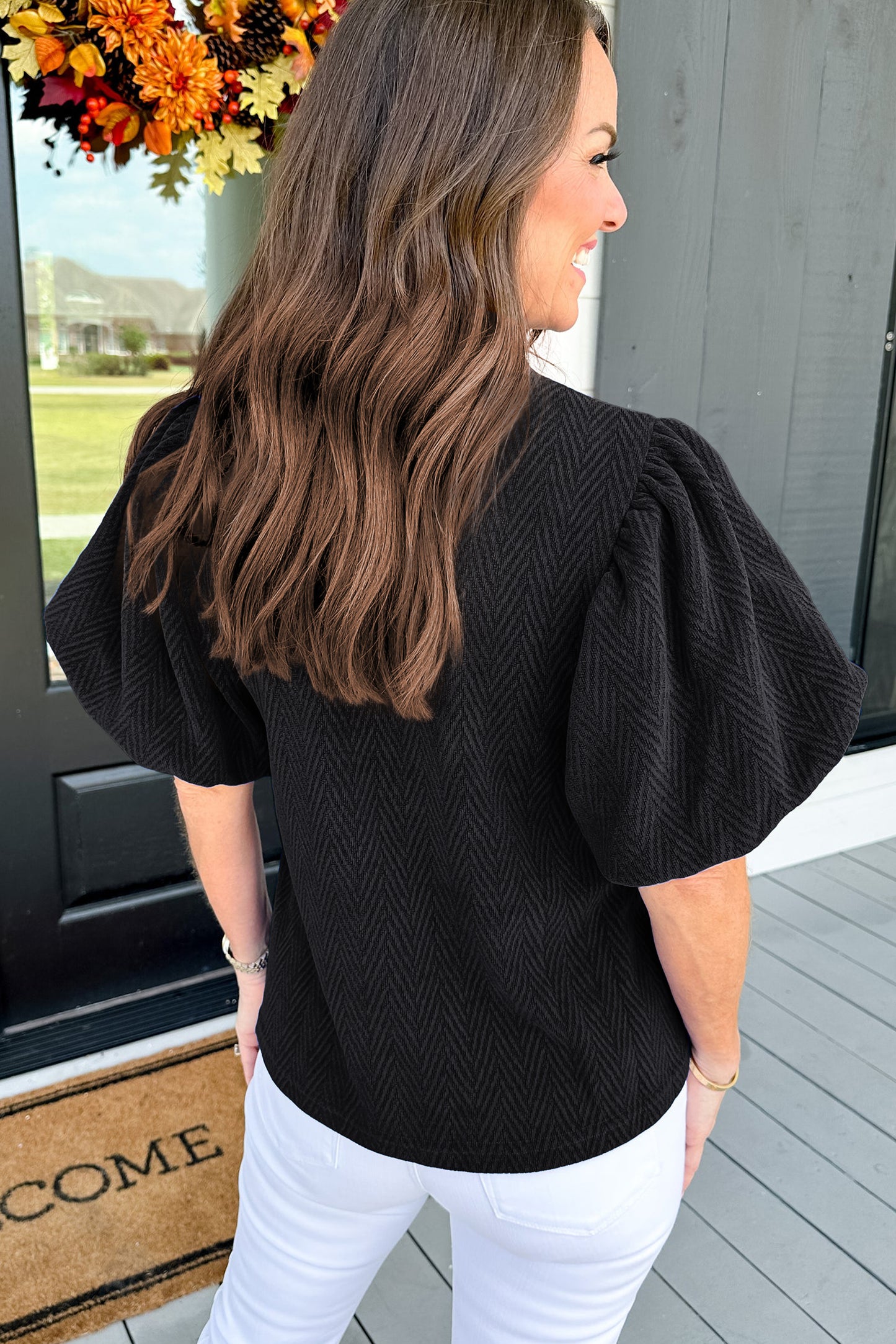 Schwarze Bluse mit Stehkragen und Puffärmeln