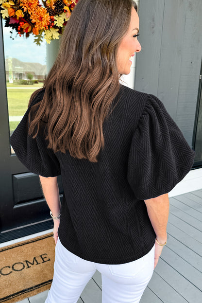 Schwarze Bluse mit Stehkragen und Puffärmeln