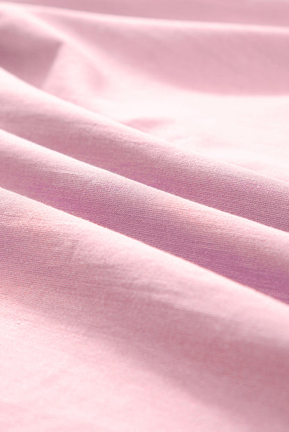 Rosa Bluse mit Blumenstickerei, Puffärmeln und Schlitz am Ausschnitt