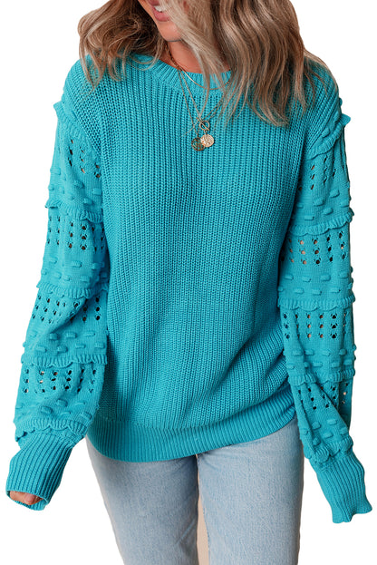 Türkisfarbener Pullover mit gerüschten Ösenärmeln