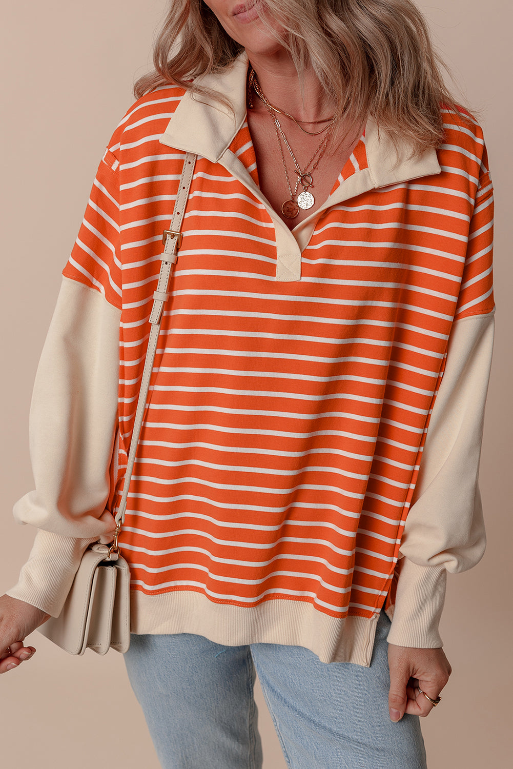Orangefarbenes Sweatshirt mit Farbblockdesign und lockerer Passform, Kragen und überschnittenen Schultern