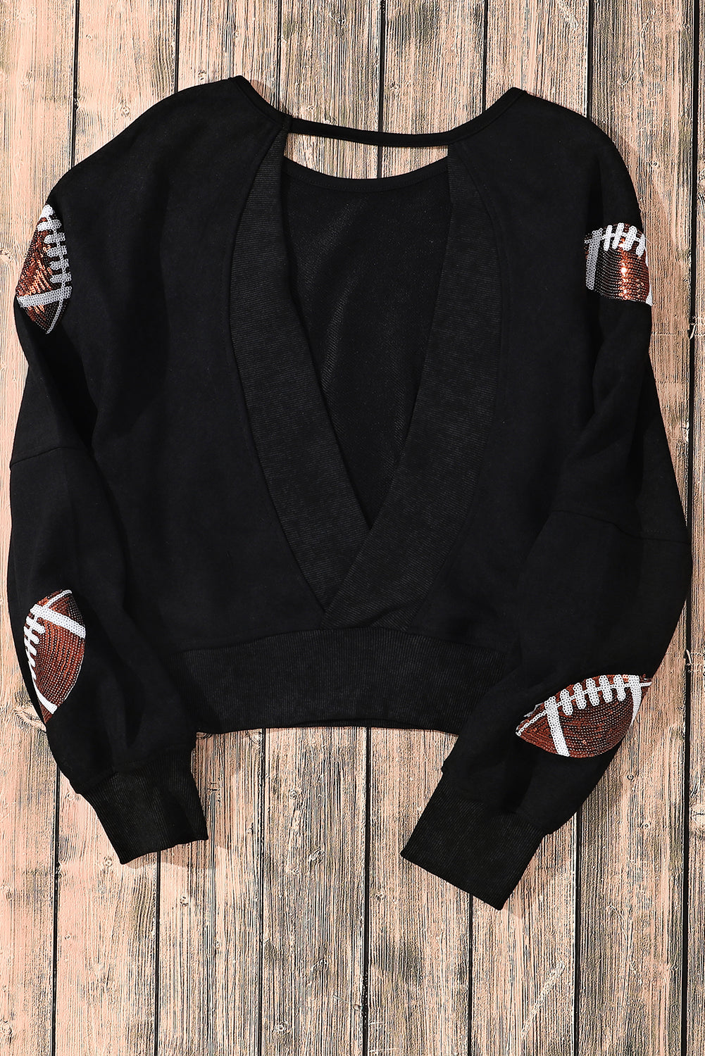 Schwarzes Sweatshirt mit offener Rückseite und Rugby-Grafik und Pailletten
