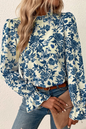 Himmelblaue Bluse mit Blumenmuster, Volantärmeln und Schlüsselloch hinten