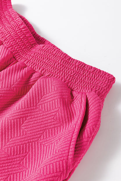 Rosarotes Set aus strukturiertem Oberteil und Hose mit Puffärmeln