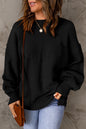Schwarzer, einfarbiger Pullover mit Puffärmeln und Taschen