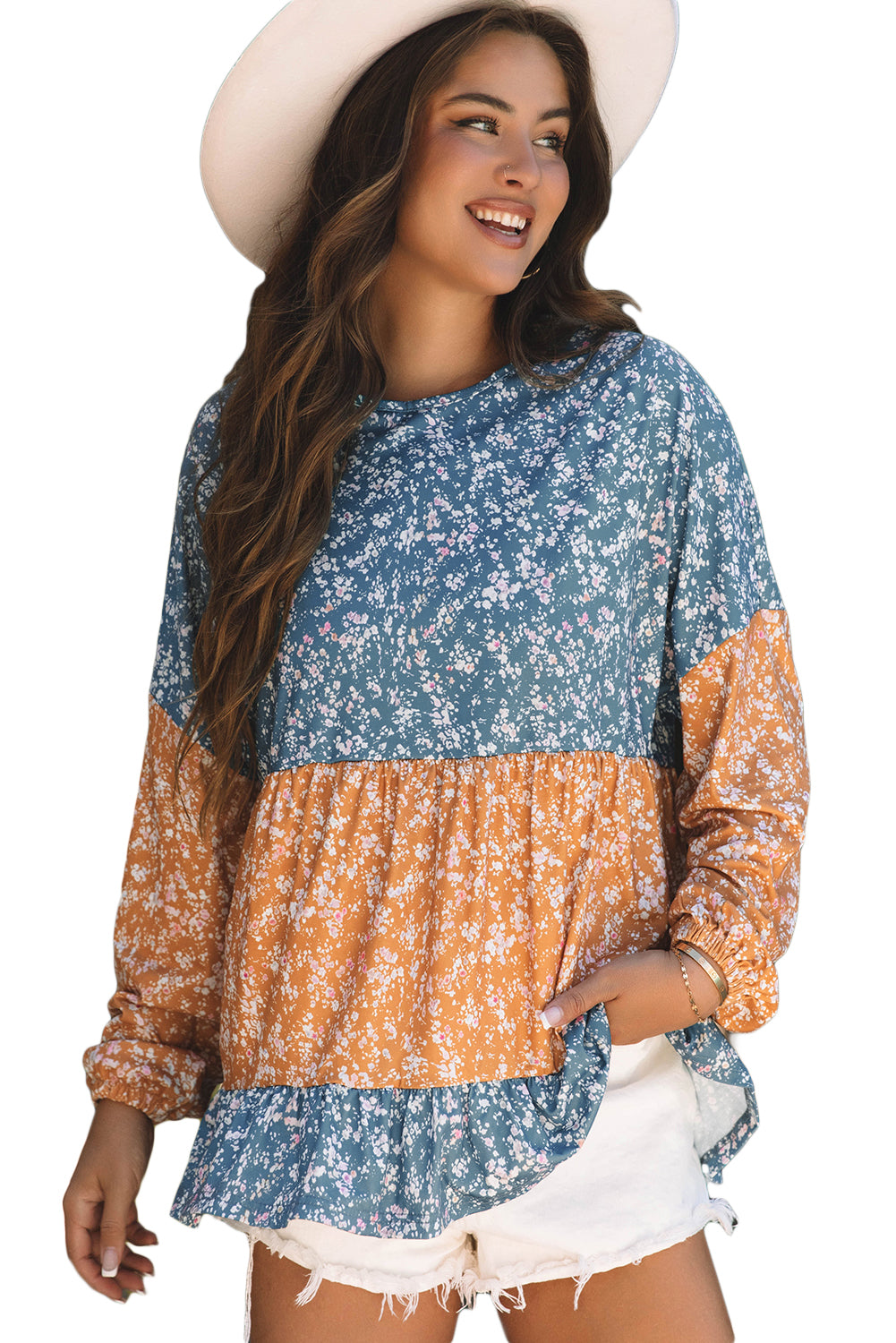 Orangefarbene Bluse mit Blumenmuster, Farbblockdesign, Rüschensaum und Rundhalsausschnitt